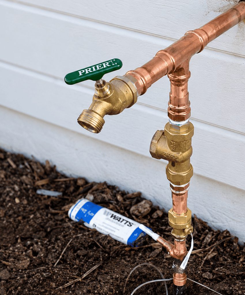 Plumbing technician on a job